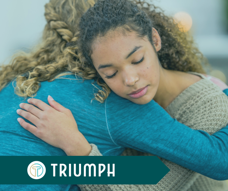 Two women hugging